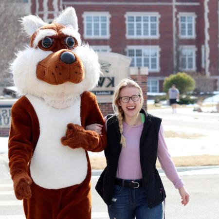 Casey the Coyote with a student